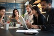 © opolja - Group of young multiracial people working in modern office. Businessmen at work during meeting.