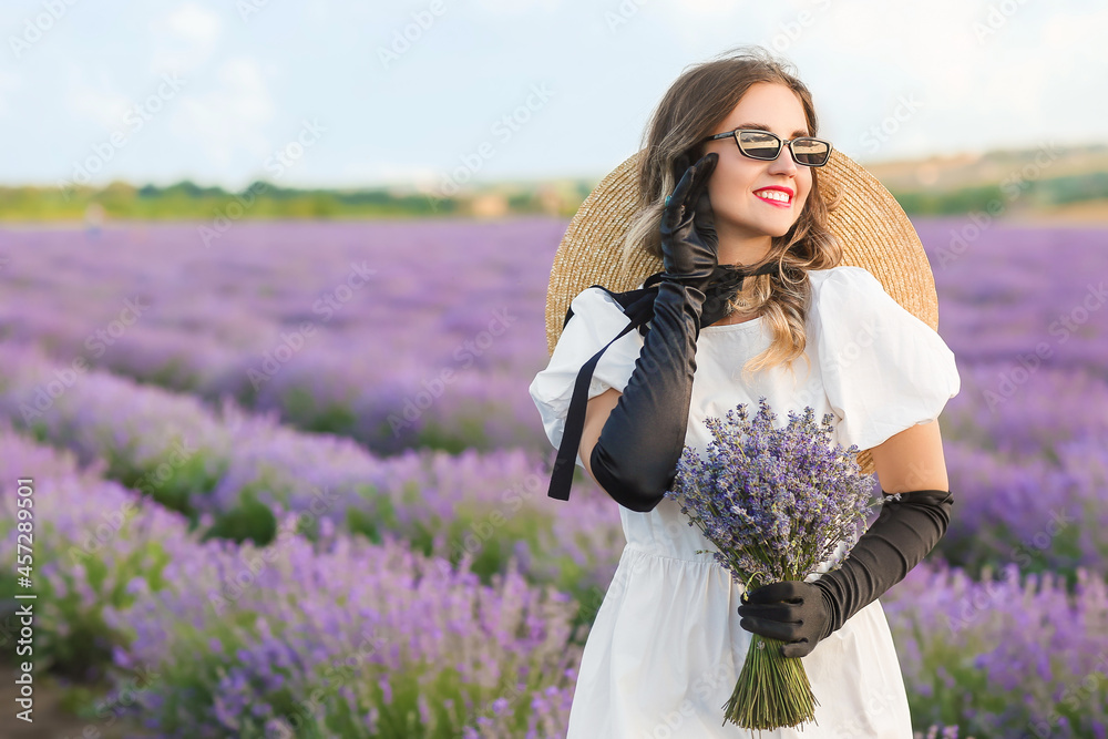 Beautiful young woman in lavender field