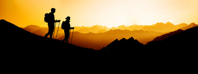 Yellow sunset landscape background banner panorama illustration  - Breathtaking view with black silhouette of mountains, hills, forest and two hikers ( woman and man hiking )