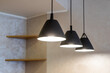 Close-up of black lamps on ceiling. Modern interior.