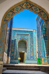 Wall Mural - Entrance arch and mausoleums of historical complex Shakhi Zinda, Samarkand, Uzbekistan. Green box on right is donation box