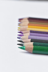 Wall Mural - Row of colorful pencils on a white background - copy space