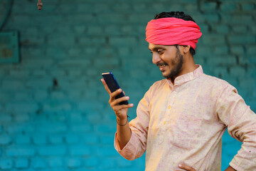 Wall Mural - Technology concept : Indian farmer using smartphone