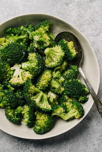 Steamed Broccoli Florets In A Bowl With Salt And Pepper