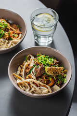 Mix of hawaiiajn Salmon and Tuna poke bowls in colorful bowls wi