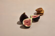 fresh figs and dried figs on beige background