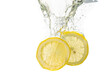 two lemon slices fall under the water with a splash