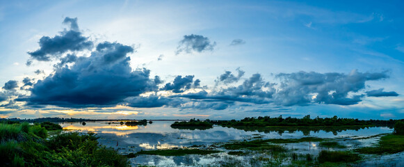 Wall Mural - panorama landscape, beautiful sunset sky on the river, sky clouds background over river