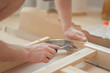 © Cavan Images - House furniture assembly process, hands of a man with a screwdriver