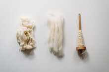 Three Stages: Uncombed Wool, Combed Wool And Yarn