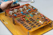 © JaneMoon - Soldering circuit board and male hands close up