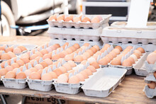 Egg Crates Of Brown And White Eggs At A Local Farmers Market From Organic Chickens.