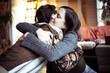 © Cavan Images - Young alternative female friends embrace in a loving hug