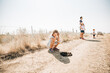 © Cavan Images - Little girl looking at horse poop while on a nature walk
