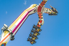 Low Angle View Of Amusement Park Ride Against Clear Blue Sky