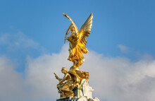 Low Angle View Of Angel Statue Against Sky
