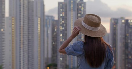 Poster - Woman enjoy the sunset view in Hong Kong