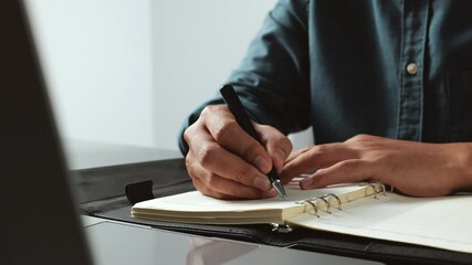 Poster - Home office desk background, Hand holding pen and writing note on table, Checklist Notice Remember Planning Concept