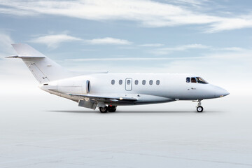 Modern white corporate business jet isolated on bright background with sky