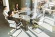 © xartproduction - Group of young business people in smart casual wear working together in office. Team at work.