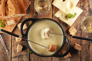 Wall Mural - cheese fondue with bread and wine