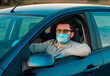 © trofalena - Man with bottle of antibacterial sanitiser protect himself from bacteria in own car