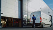 © Gorodenkoff - Outside of Logistics Distributions Warehouse Worker Loading Delivery Truck with Cardboard Boxes. Online Orders, Purchases, E-Commerce Goods.