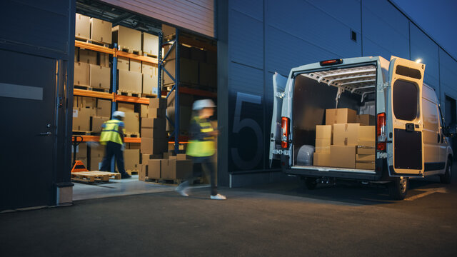Fototapete - Outside of Logistics Distributions Warehouse Diverse Team of Workers Loading Delivery Truck with Cardboard Boxes. Online Orders, Purchases, E-Commerce Goods, Supply Chain. Blur Motion Shot.