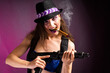 Sexy criminal female smoking a cigar and posing with a gun