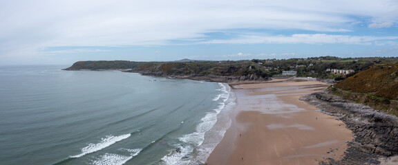 Wall Mural - The huge surfing beach of Caswell Bay, on the South Wales Coast Path, at low tide