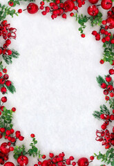 Wall Mural - christmas decoration. frame of twigs christmas tree, red berries, red apples on snow with space for 
