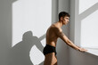 © SHOTPRIME STUDIO - male bodybuilder in black shorts posing near the window