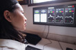 © ADDICTIVE STOCK - Serious ethnic female trader analyzing cryptocurrency market statistics