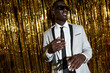 © ADDICTIVE STOCK - Stylish black man in sunglasses dancing during party