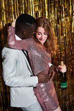 Content Multiracial Couple With Champagne Celebrating New Years Eve