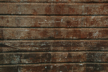 Sticker - Closeup of an old dark brown wooden wall.