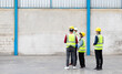 © NVB Stocker - Group portrait of asian people worker wearing safety vest and hardhat helmet workingin warehouse. logistic and business import export.