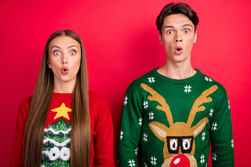 Canvas Print - Photo of excited couple girl guy open mouth omg reaction wear ugly sweater isolated red color background