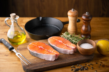 Wall Mural - fresh salmon steak on wooden cutting board