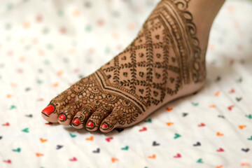 Wall Mural - Ledy Feet and Hands in Heena for wedding in white background and isolated hand and feet  | hand design | feet design | beautiful design | nice design 