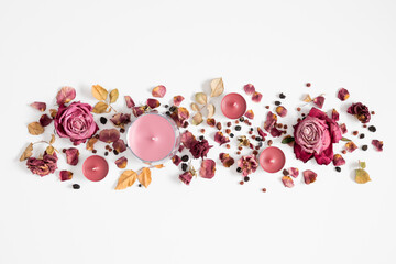 Wall Mural - autumn composition with dry roses and candles. autumn background in pastel color with dried rose flo