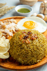 Wall Mural - Fried rice is a dish of cooked rice that has been stir-fried in a wok or a frying pan and is usually mixed with other ingredients such as eggs, vegetables, seafood, or meat.