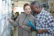 © auremar - hardwarer store worker assisting customer
