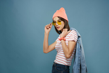 Wall Mural - woman in striped t-shirt wearing pink hat fashion posing in modern style