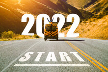 Start New Year 2022 To Begin Journey In Upcoming Year Concept. Abstract Image Of The Asphalt Road With Touring Mini Van Car Painted With Tiger Pattern Heading To Text Written 2022. Chinese New Year.