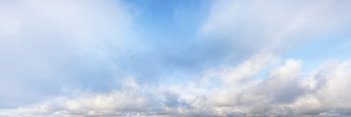 Wall Mural - blue cloudy sky at the horizon panoramic view