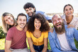 © Xavier Lorenzo - Multiracial group of young people - Happy millennial friends from different cultures smiling at smartphone camera - Friendship and youth concept with diverse millennial students sitting together