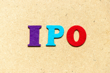 Poster - Color cloth alphabet letter in word IPO (Abbreviation of Initial Public Offering) on wood background