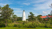 Ocracoke Light And The Red Roof Of The Lighthouse Keeper's House On A Summer Morning