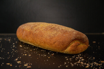 Poster - Closeup shot of a whole loaf of bread on a table